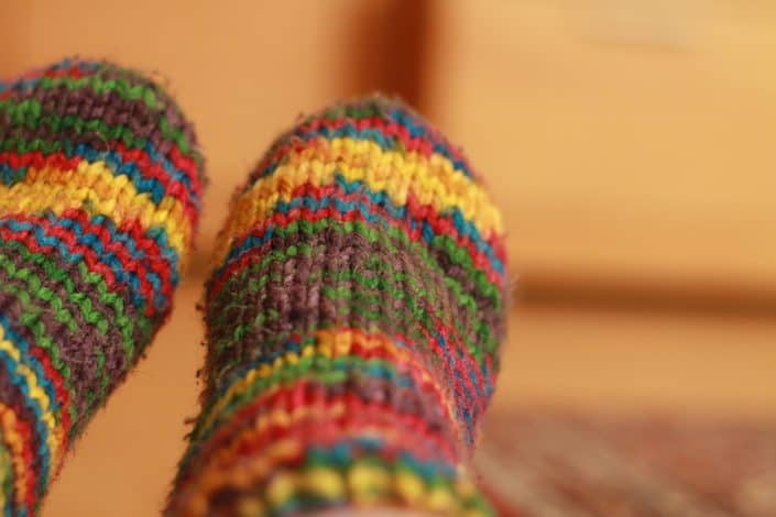 Wool and organic materials tend to keep the feet warmer