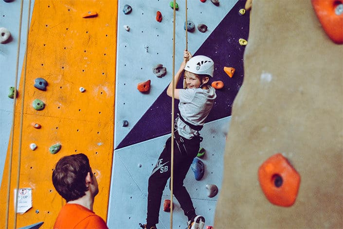 Girl on a climbing wall