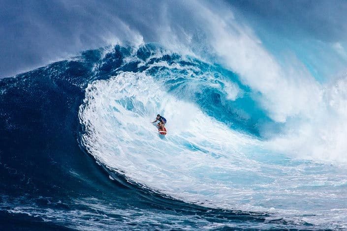 Surfer riding a huge wave