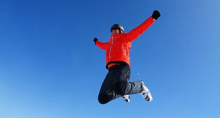 Man jumping with snow boots on
