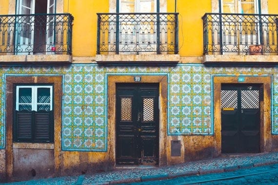 school sports tours Portugal Lisbon street scene yellow house with tiles