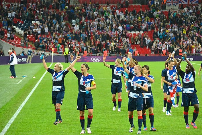 Team GB celebrating womens football